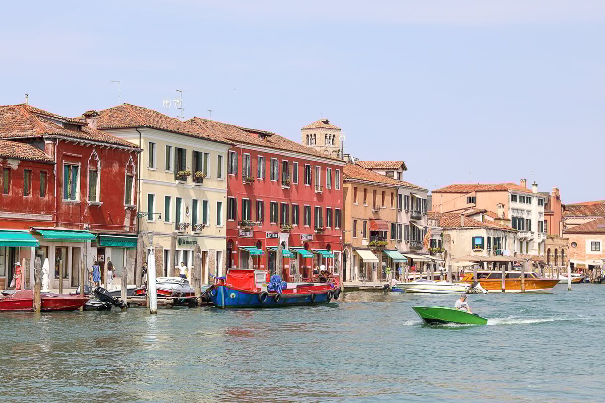 Colorful souvenir shops by a canal in Murano. A day trip to Murano and Burano is a must-have!