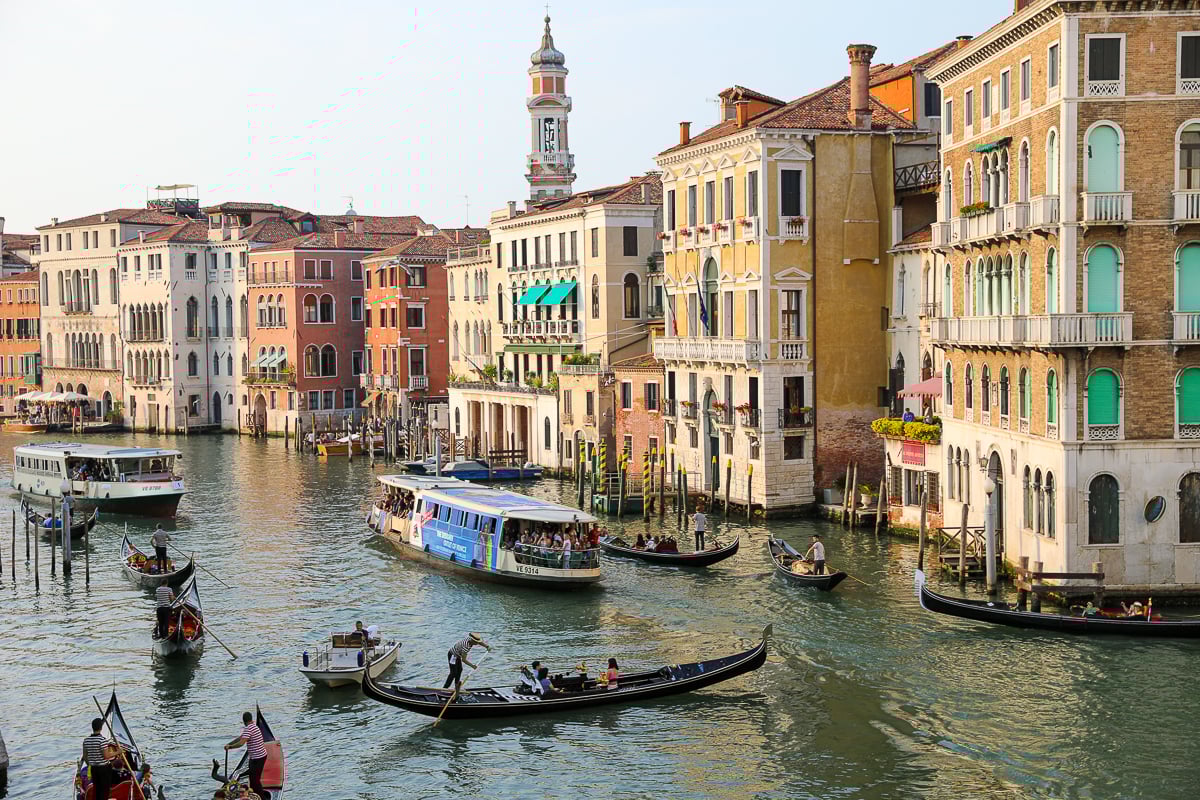 The busy Grand Canal in Venice with boats and gondolas going in all directions
